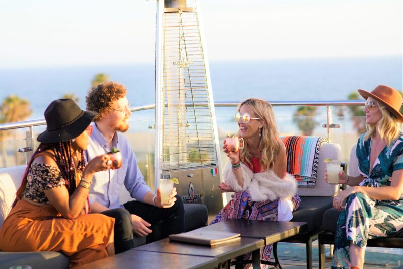 People enjoying happy hour at High Rooftop Lounge